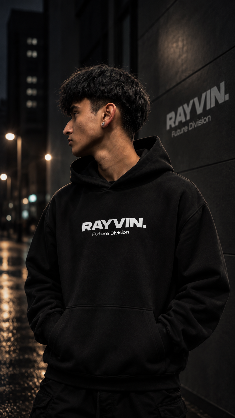 RAYVIN Future Division black hoodie campaign with model wearing the hoodie